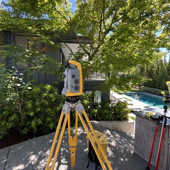 Surveying equipment set up at a residential property